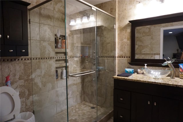 13785 SE 39th Ter, Summerfield, FL 34491 - bathroom with vanity, tile walls, and a shower stall