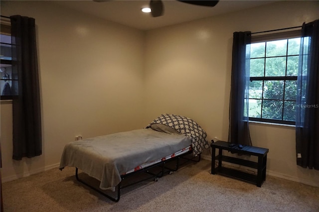 13785 SE 39th Ter, Summerfield, FL 34491 - carpeted bedroom with multiple windows, recessed lighting, and a ceiling fan