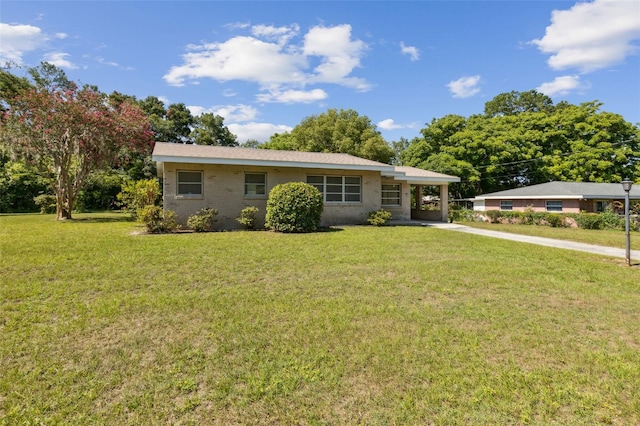 146 Mills Rd, Deland, FL 32724 - ranch-style house with concrete driveway, a front lawn, and a carport