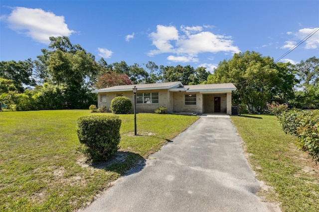 146 Mills Rd, Deland, FL 32724 - view of front of property featuring driveway, a front lawn, and an attached carport