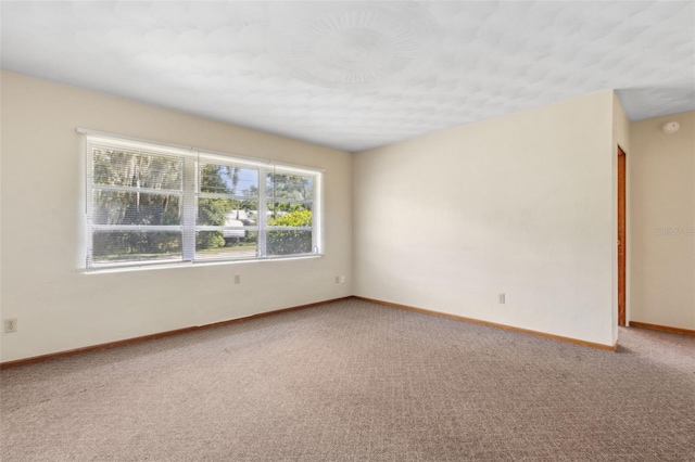 146 Mills Rd, Deland, FL 32724 - unfurnished room featuring carpet floors and a smoke detector