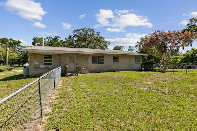 146 Mills Rd, Deland, FL 32724 - back of house featuring brick siding and a fenced backyard