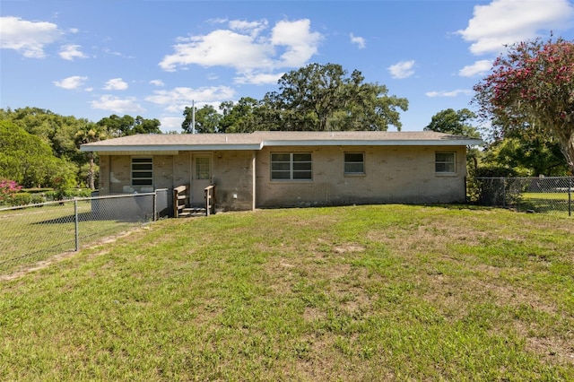146 Mills Rd, Deland, FL 32724 - rear view of property featuring a fenced backyard and brick siding