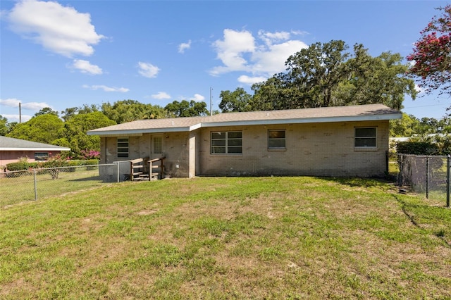 146 Mills Rd, Deland, FL 32724 - back of property featuring a fenced backyard and brick siding