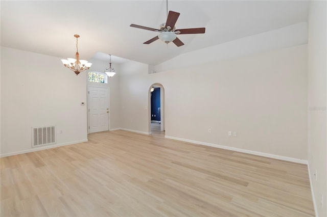 16603 Corner Lake Dr, Orlando, FL 32820 - empty room featuring arched walkways, a chandelier, lofted ceiling, light wood finished floors, and a ceiling fan