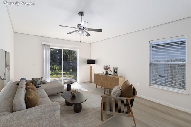 16603 Corner Lake Dr, Orlando, FL 32820 - living area with wood finished floors and ceiling fan