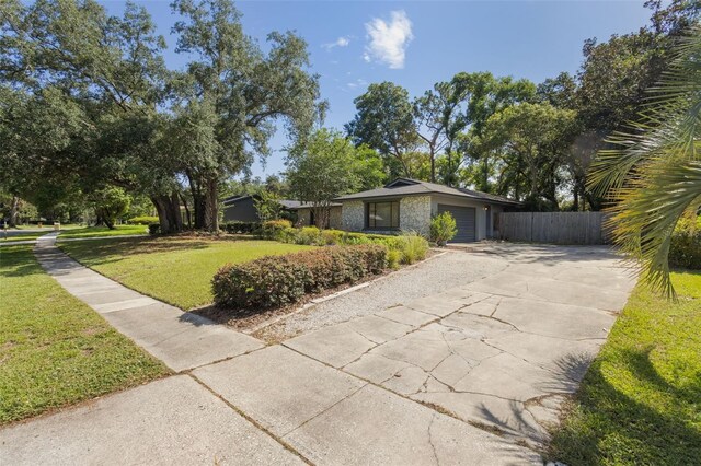1029 Antelope Trl, Winter Springs, FL 32708 - mid-century home featuring a garage and driveway