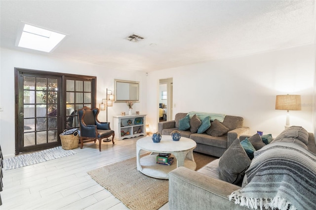 1029 Antelope Trl, Winter Springs, FL 32708 - living area with a skylight, healthy amount of natural light, and light wood-style flooring