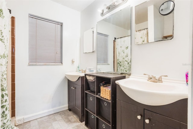 1029 Antelope Trl, Winter Springs, FL 32708 - full bathroom featuring two vanities and baseboards