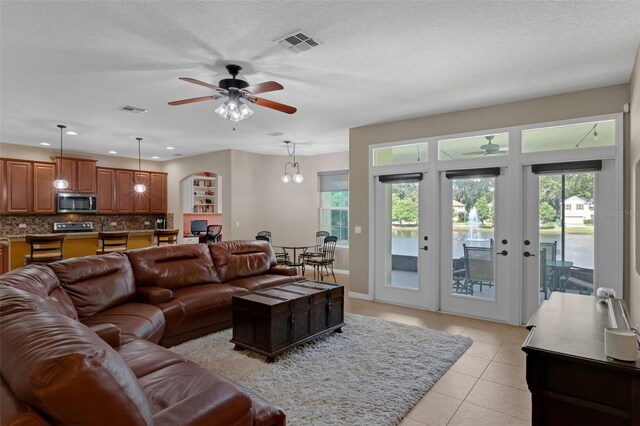 480 Buckhorn Dr, Winter Springs, FL 32708 - living room featuring a ceiling fan, plenty of natural light, light tile patterned flooring, french doors, and recessed lighting