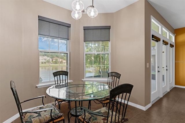 480 Buckhorn Dr, Winter Springs, FL 32708 - dining room featuring a chandelier and dark tile patterned flooring