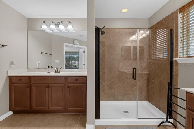 480 Buckhorn Dr, Winter Springs, FL 32708 - full bathroom featuring vanity, healthy amount of natural light, a stall shower, and tile patterned flooring