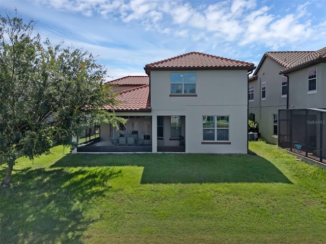 480 Buckhorn Dr, Winter Springs, FL 32708 - rear view of house with a tiled roof, a sunroom, and a yard