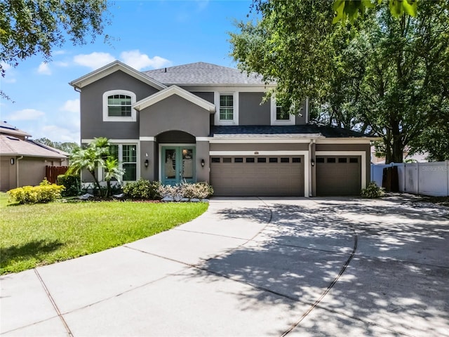 207 Via Tuscany Loop, Lake Mary, FL 32746 - traditional-style home with stucco siding, an attached garage, and driveway