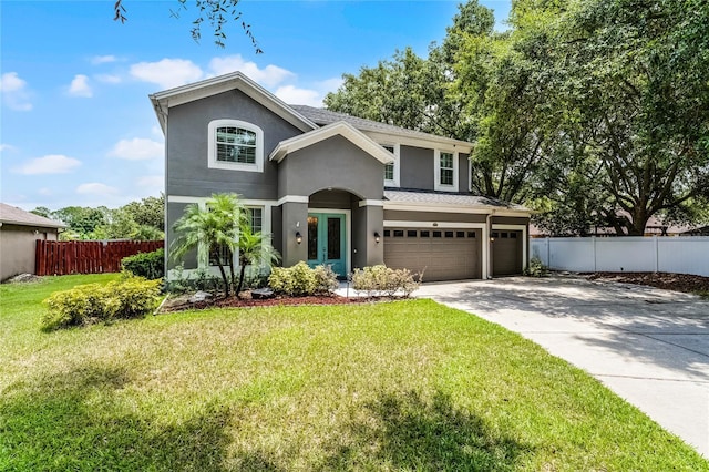 207 Via Tuscany Loop, Lake Mary, FL 32746 - view of front facade with stucco siding, a garage, french doors, concrete driveway, and a shingled roof