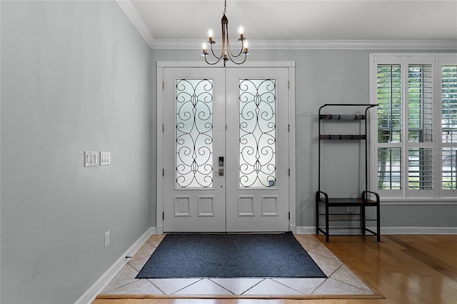 207 Via Tuscany Loop, Lake Mary, FL 32746 - foyer featuring a chandelier, plenty of natural light, ornamental molding, and light tile patterned floors
