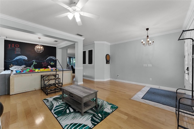 207 Via Tuscany Loop, Lake Mary, FL 32746 - living room featuring a chandelier, light wood finished floors, ornamental molding, and ceiling fan