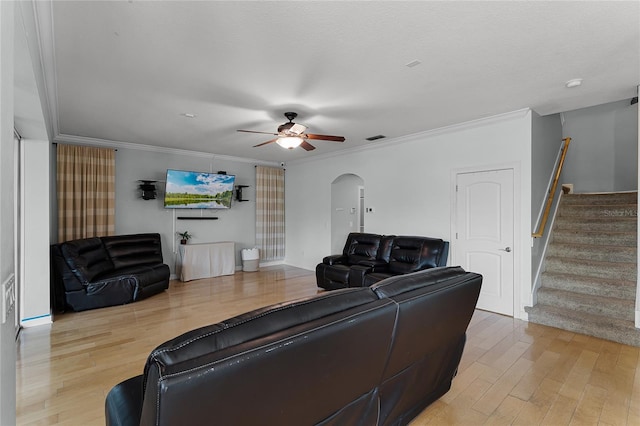 207 Via Tuscany Loop, Lake Mary, FL 32746 - living area with light wood-style floors, a ceiling fan, crown molding, arched walkways, and stairs