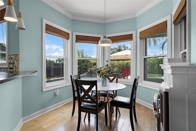 207 Via Tuscany Loop, Lake Mary, FL 32746 - dining space with crown molding and light wood-style floors