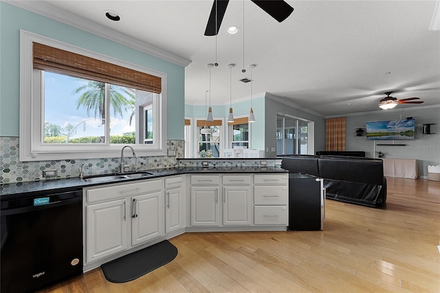 207 Via Tuscany Loop, Lake Mary, FL 32746 - kitchen with black dishwasher, ceiling fan, open floor plan, dark countertops, and crown molding