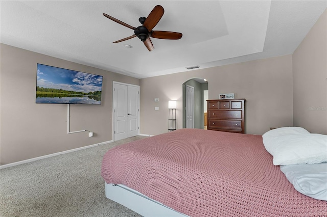 207 Via Tuscany Loop, Lake Mary, FL 32746 - bedroom with arched walkways, carpet, a closet, and a ceiling fan
