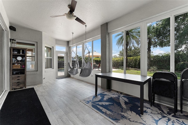 207 Via Tuscany Loop, Lake Mary, FL 32746 - sunroom featuring a textured ceiling and wood finished floors