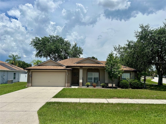 734 La Costa St, Minneola, FL 34715 - single story home featuring a garage, a front lawn, driveway, and stucco siding
