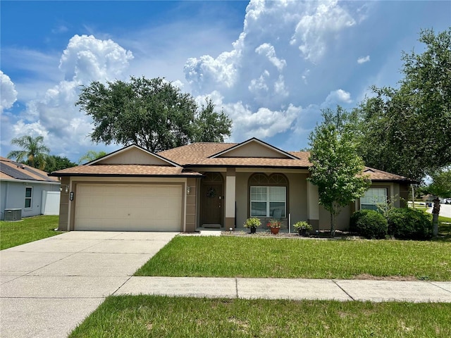 734 La Costa St, Minneola, FL 34715 - ranch-style house featuring stucco siding, a garage, a front yard, concrete driveway, and roof with shingles