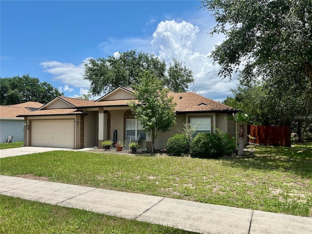 734 La Costa St, Minneola, FL 34715 - ranch-style home with an attached garage, stucco siding, and driveway