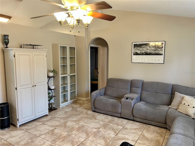 734 La Costa St, Minneola, FL 34715 - living room featuring arched walkways, ceiling fan, light tile patterned floors, and vaulted ceiling