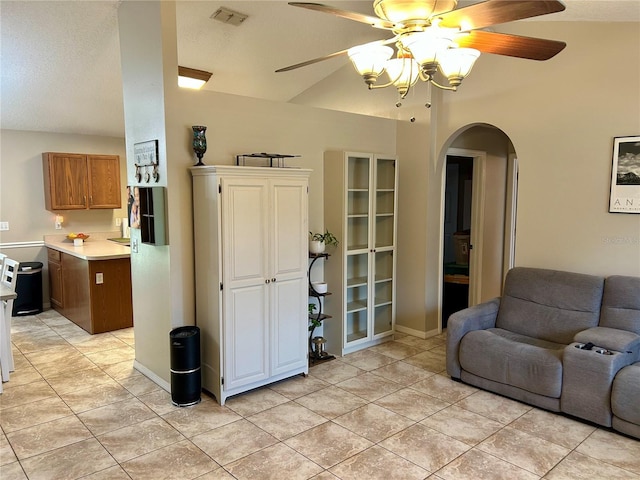 734 La Costa St, Minneola, FL 34715 - living room with a ceiling fan, arched walkways, and light tile patterned floors