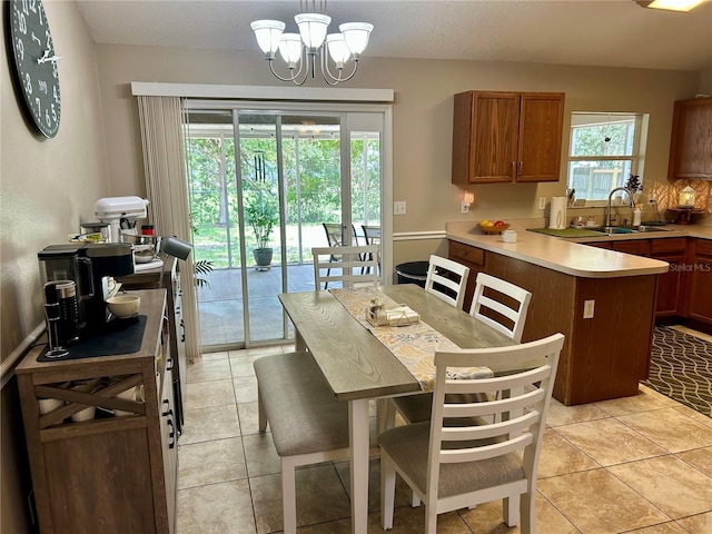 734 La Costa St, Minneola, FL 34715 - dining space with a chandelier and light tile patterned floors