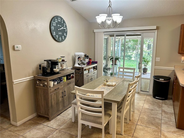 734 La Costa St, Minneola, FL 34715 - dining room featuring arched walkways, lofted ceiling, a chandelier, and light tile patterned floors