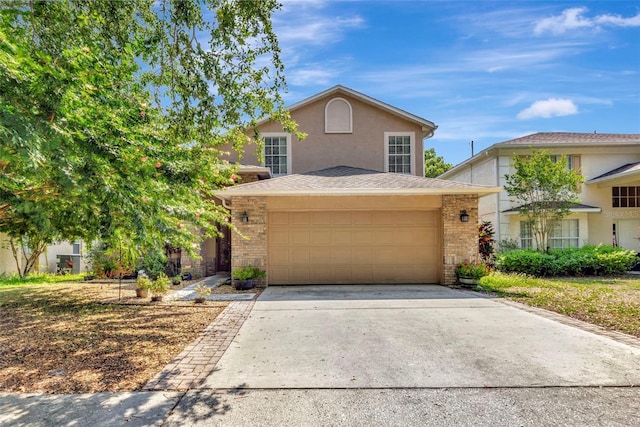 1039 Eagles Forrest Dr, Apopka, FL 32712 - traditional-style home with concrete driveway, stucco siding, brick siding, and a garage