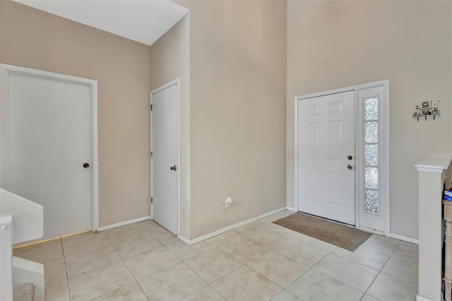 1039 Eagles Forrest Dr, Apopka, FL 32712 - foyer featuring light tile patterned floors and a towering ceiling