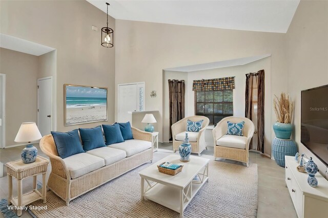 1039 Eagles Forrest Dr, Apopka, FL 32712 - living room with high vaulted ceiling and light tile patterned flooring
