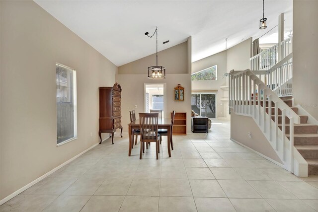 1039 Eagles Forrest Dr, Apopka, FL 32712 - dining space with high vaulted ceiling, stairs, and light tile patterned flooring