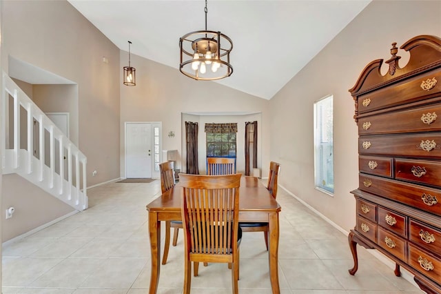 1039 Eagles Forrest Dr, Apopka, FL 32712 - dining space with stairs, light tile patterned floors, high vaulted ceiling, and a chandelier