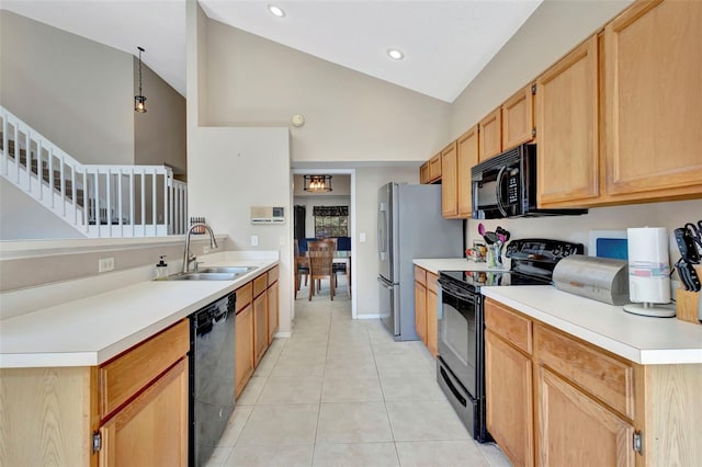 1039 Eagles Forrest Dr, Apopka, FL 32712 - kitchen with black appliances, light tile patterned floors, light countertops, light brown cabinetry, and a peninsula