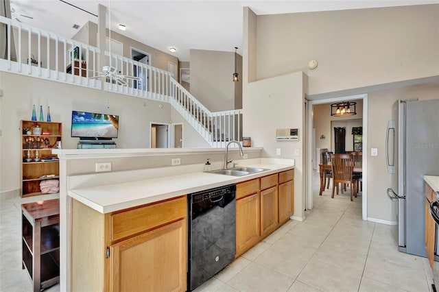 1039 Eagles Forrest Dr, Apopka, FL 32712 - kitchen featuring dishwasher, a high ceiling, freestanding refrigerator, a peninsula, and light tile patterned floors
