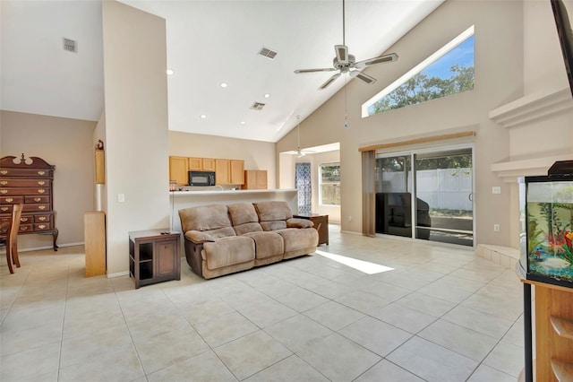 1039 Eagles Forrest Dr, Apopka, FL 32712 - living area with high vaulted ceiling, light tile patterned flooring, ceiling fan, and recessed lighting