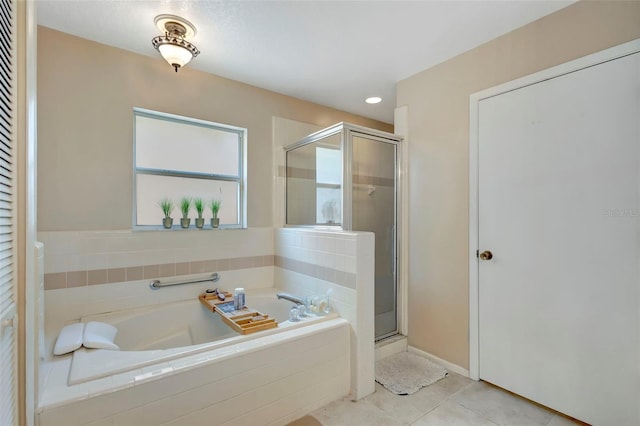 1039 Eagles Forrest Dr, Apopka, FL 32712 - full bath featuring a bath, a shower stall, and tile patterned flooring