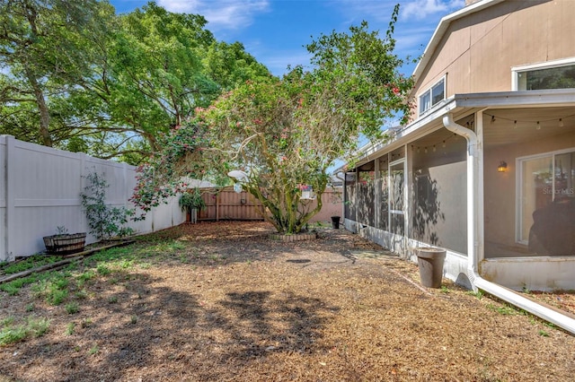1039 Eagles Forrest Dr, Apopka, FL 32712 - fenced backyard with a sunroom