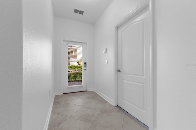 8970 Azalea Sands Ln Unit 2302, Davenport, FL 33896 - doorway to outside featuring baseboards and light tile patterned floors