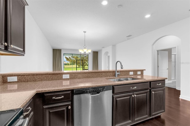 8970 Azalea Sands Ln Unit 2302, Davenport, FL 33896 - kitchen with stainless steel appliances, dark wood-type flooring, arched walkways, a chandelier, and decorative light fixtures