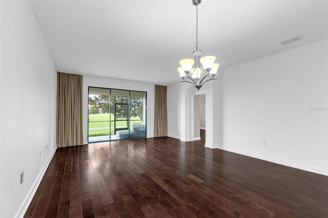 8970 Azalea Sands Ln Unit 2302, Davenport, FL 33896 - spare room featuring a chandelier, dark wood-style flooring, and arched walkways