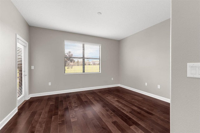 8970 Azalea Sands Ln Unit 2302, Davenport, FL 33896 - spare room with dark wood-style floors and baseboards