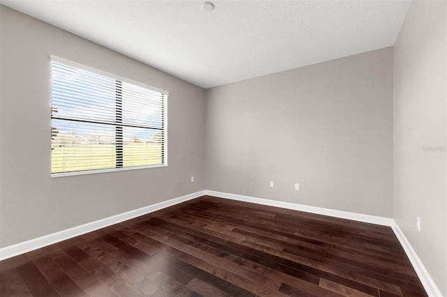 8970 Azalea Sands Ln Unit 2302, Davenport, FL 33896 - empty room with dark wood-style flooring and baseboards