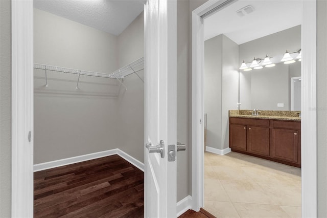 8970 Azalea Sands Ln Unit 2302, Davenport, FL 33896 - spacious closet with a sink and light wood-style flooring