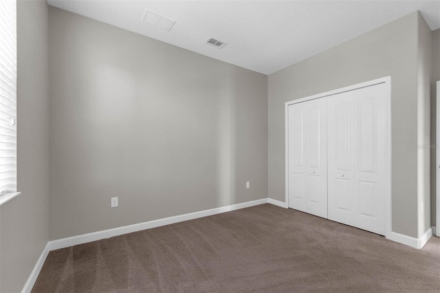 8970 Azalea Sands Ln Unit 2302, Davenport, FL 33896 - unfurnished bedroom with carpet floors and a closet